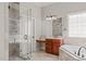Bathroom includes a glass-enclosed shower, soaking tub, and a vanity with ample storage at 5410 Highcroft Dr, Cary, NC 27519