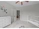 Bright Bedroom with a crib, changing table, and access to another room through a doorway at 5410 Highcroft Dr, Cary, NC 27519