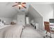 Bright bedroom featuring a bed, built-in cabinets, and a writing desk with a chair at 5410 Highcroft Dr, Cary, NC 27519