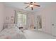 Sunlit bedroom with a single bed, canopy, and views of the outside through the window at 5410 Highcroft Dr, Cary, NC 27519