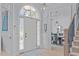Bright foyer with an arched window above the front door and views into the dining room at 5410 Highcroft Dr, Cary, NC 27519