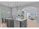 Kitchen featuring a central island, with an open layout leading into the living room at 5410 Highcroft Dr, Cary, NC 27519