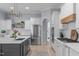 Spacious kitchen with stainless steel appliances, white cabinetry, and a large center island at 5410 Highcroft Dr, Cary, NC 27519