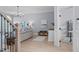 Open-concept living room with hardwood floors, light blue walls, and chandelier at 5410 Highcroft Dr, Cary, NC 27519
