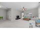 Spacious living room with neutral tones, ceiling fan and cozy seating area for relaxation at 5410 Highcroft Dr, Cary, NC 27519
