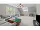 Playful living area with a couch, lots of toys and a large window at 5410 Highcroft Dr, Cary, NC 27519