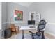 Cozy office with desk, rolling chair, bookshelf, hardwood floors, and light blue walls at 5410 Highcroft Dr, Cary, NC 27519