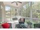Relaxing screened-in porch with stylish seating and tranquil views of the surrounding greenery at 5410 Highcroft Dr, Cary, NC 27519