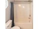 Bathroom featuring a shower with a tub, a toilet, and a partially visible curtain at 5410 Pageford Dr, Durham, NC 27703