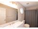 Bathroom featuring a large mirror, vanity with gold faucets, and a shower with curtain at 5410 Pageford Dr, Durham, NC 27703