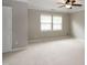 Bedroom with neutral carpet, ceiling fan, and bright windows at 5410 Pageford Dr, Durham, NC 27703