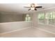 Neutral bonus room with carpet, ceiling fan, and natural light at 5410 Pageford Dr, Durham, NC 27703