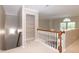 Open landing with shelving and natural light from the window at 5410 Pageford Dr, Durham, NC 27703