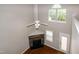 Living room with fireplace, wood floors, ceiling fan and lots of light at 5410 Pageford Dr, Durham, NC 27703