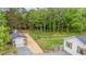 An aerial view of the property and the large garage with a fenced-in backyard at 553 Isley Rd, Haw River, NC 27258