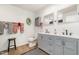 Bathroom with double sink vanity, gray cabinets, matte black fixtures, and decorated with red patterned towels at 553 Isley Rd, Haw River, NC 27258