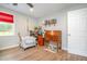 Bonus room with wood floors, a ceiling fan, and a vintage secretary desk at 553 Isley Rd, Haw River, NC 27258