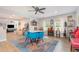 Inviting dining area featuring an open concept, colorful rug, and natural light at 553 Isley Rd, Haw River, NC 27258