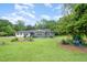 Well-maintained home with a manicured front yard and mature trees at 553 Isley Rd, Haw River, NC 27258