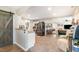Open-concept kitchen featuring a sliding barn door and modern appliances, seamlessly connects to the living area at 553 Isley Rd, Haw River, NC 27258