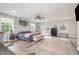 Spacious main bedroom with multiple windows, wood floors, ceiling fan and walk in closet, filled with natural light at 553 Isley Rd, Haw River, NC 27258