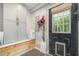 Functional mudroom with built-in storage, wood accents, and an exterior door with a dog door for convenience at 553 Isley Rd, Haw River, NC 27258