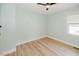 Clean and simple bedroom features a minimalist design with plenty of natural light and wood laminate flooring at 64 Red House Rd, Smithfield, NC 27577