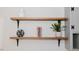 Modern floating shelves add storage and design to this kitchen at 64 Red House Rd, Smithfield, NC 27577