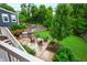 Spacious backyard featuring a patio with an outdoor kitchen and a fire pit seating area at 729 Mills St, Raleigh, NC 27608