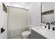 Well-appointed bathroom with a stylish vanity, matte black hardware, and a shower with curtain at 729 Mills St, Raleigh, NC 27608