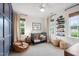 Inviting bedroom featuring a crib, beanbag chair, and ample natural light at 729 Mills St, Raleigh, NC 27608