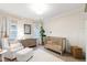 Cozy Bedroom with a crib, armchair, and plenty of natural light at 729 Mills St, Raleigh, NC 27608