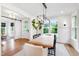 Stylish dining room showcasing modern light fixture, table with chairs, and bright windows at 729 Mills St, Raleigh, NC 27608
