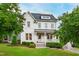 Charming two-story home with landscaped yard, covered porch, and classic white siding at 729 Mills St, Raleigh, NC 27608