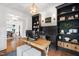 Bright home office with built-in bookshelves, stylish desk, and decorative lighting at 729 Mills St, Raleigh, NC 27608