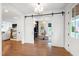 Open view of home office with sliding doors, built-ins, and desk area at 729 Mills St, Raleigh, NC 27608