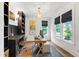 Cozy home office featuring custom built-ins, stylish decor, and ample natural light at 729 Mills St, Raleigh, NC 27608