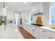 Gourmet kitchen with white cabinets, stainless steel appliances, and a marble countertop at 729 Mills St, Raleigh, NC 27608