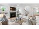 Comfortable living room with fireplace, built-in shelves, and stylish decor at 729 Mills St, Raleigh, NC 27608