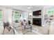 Spacious living room featuring bright white furniture and marble fireplace at 729 Mills St, Raleigh, NC 27608