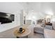 Upstairs bonus living room with a view to the bathroom, playroom, and large TV at 729 Mills St, Raleigh, NC 27608