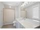 This bathroom has a white marble vanity and a shower with a beige shower curtain, providing both style and function at 7417 Dover Hills Dr # 73, Wake Forest, NC 27587