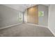 Bright bedroom with vaulted ceiling, three modern windows and paneled accent wall with a modern ceiling fan at 7417 Dover Hills Dr # 73, Wake Forest, NC 27587