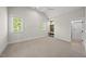 Bright bedroom with vaulted ceiling, two windows, and a built-in desk providing an ideal space for relaxation and productivity at 7417 Dover Hills Dr # 73, Wake Forest, NC 27587