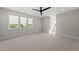 Bright bedroom with vaulted ceiling, three modern windows providing an ideal space for relaxation and rest at 7417 Dover Hills Dr # 73, Wake Forest, NC 27587