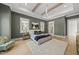 This spacious bedroom has lots of natural light, a ceiling fan, and a glimpse of the bathroom at 7417 Dover Hills Dr # 73, Wake Forest, NC 27587