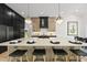 Spacious open-concept kitchen featuring a large island with counter seating and modern fixtures at 7417 Dover Hills Dr # 73, Wake Forest, NC 27587