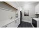 Modern laundry room with stainless steel appliances and white cabinets at 7417 Dover Hills Dr # 73, Wake Forest, NC 27587