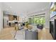 Open-concept living room and kitchen area with hardwood floors and sliding glass doors to the exterior at 7417 Dover Hills Dr # 73, Wake Forest, NC 27587