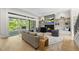 Beautiful living room with hardwood floors, fireplace, TV, and large sliding glass doors to the exterior at 7417 Dover Hills Dr # 73, Wake Forest, NC 27587